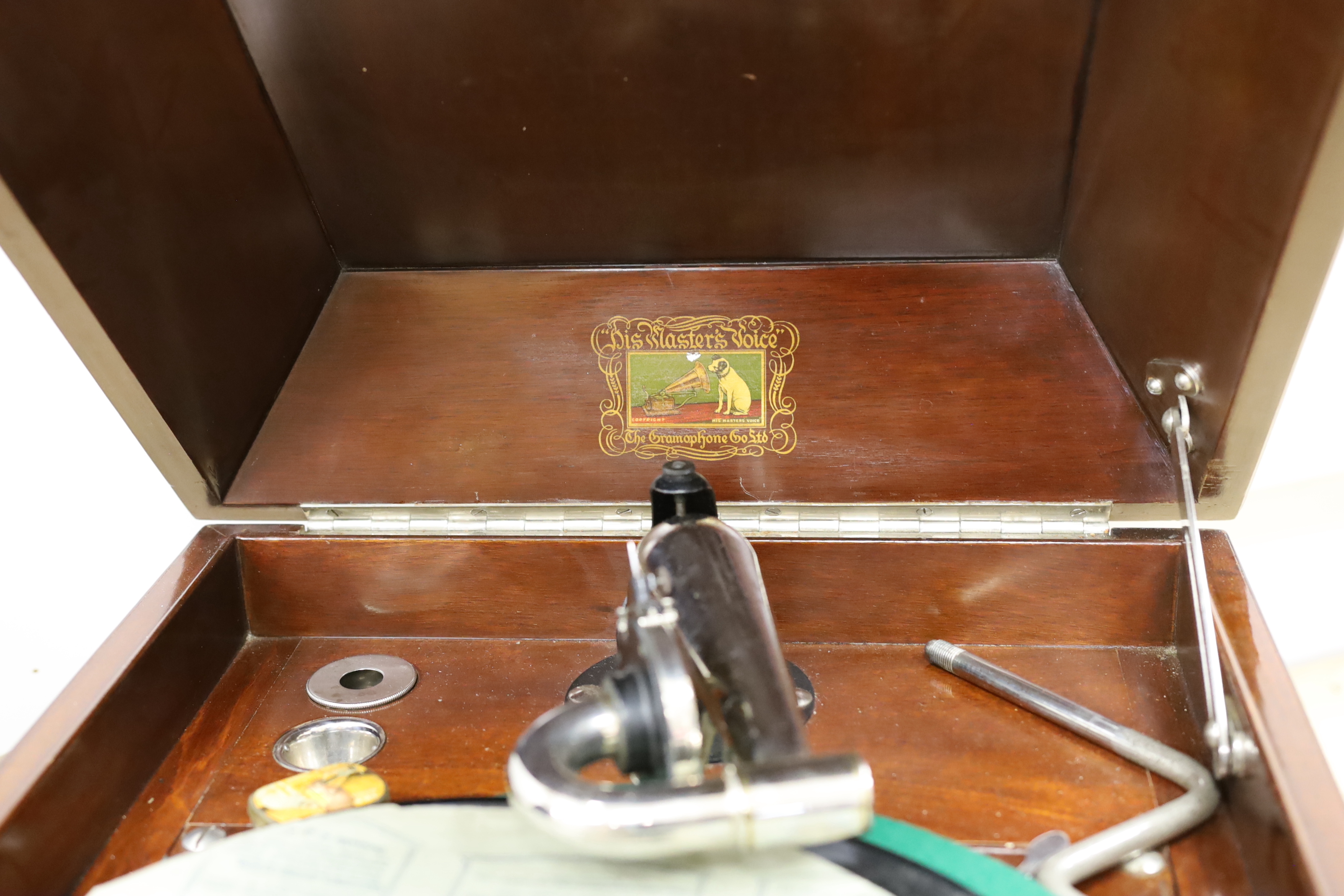 An HMV gramophone and a portable HMV gramophone, together with a small number of 78s